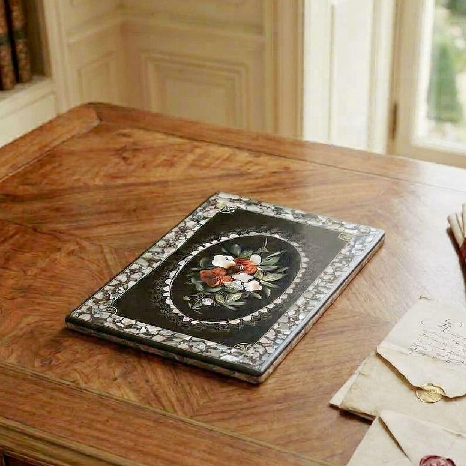 Antique Napoleon III mother-of-pearl desk blotter styled flat on a French writing desk in an elegant library