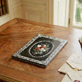 Antique Napoleon III mother-of-pearl desk blotter styled flat on a French writing desk in an elegant library