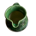 Hand-thrown Savoyard pottery pitcher with annelée texture spout detail