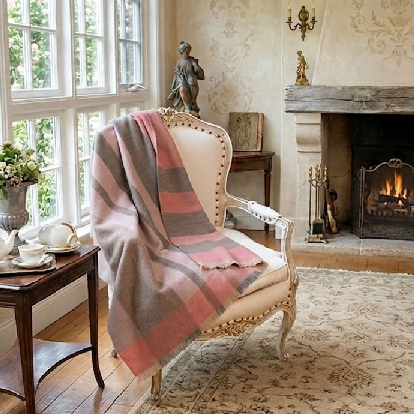 Gorgeous Warm Luxury alpaca soft wool throw in pinks in a French country home on an antique French chair