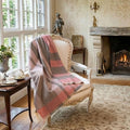 Gorgeous Warm Luxury alpaca soft wool throw in pinks in a French country home on an antique French chair