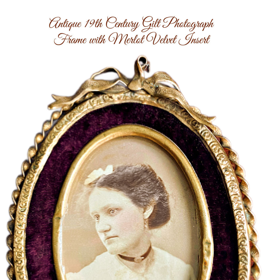 Detail of ornate gilt frame with rich merlot velvet backing interior