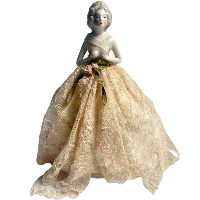 Detail of skirt of French lace boudoir doll lamp  with café au lait skirt and gold ribbon detail