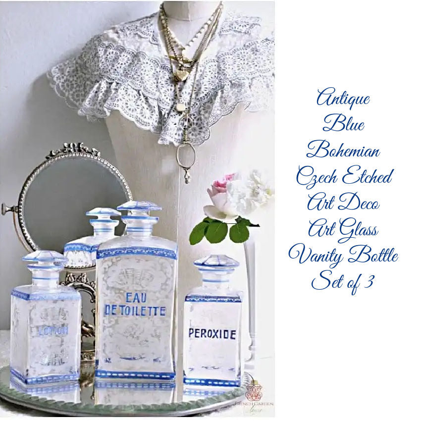 Bohemian etched glass dressing table set with three vanity bottles in the style of Friedrich Egermann. Art Deco Czech Bohemian art glass, finely engraved, displayed with antique mirror and mannequin.