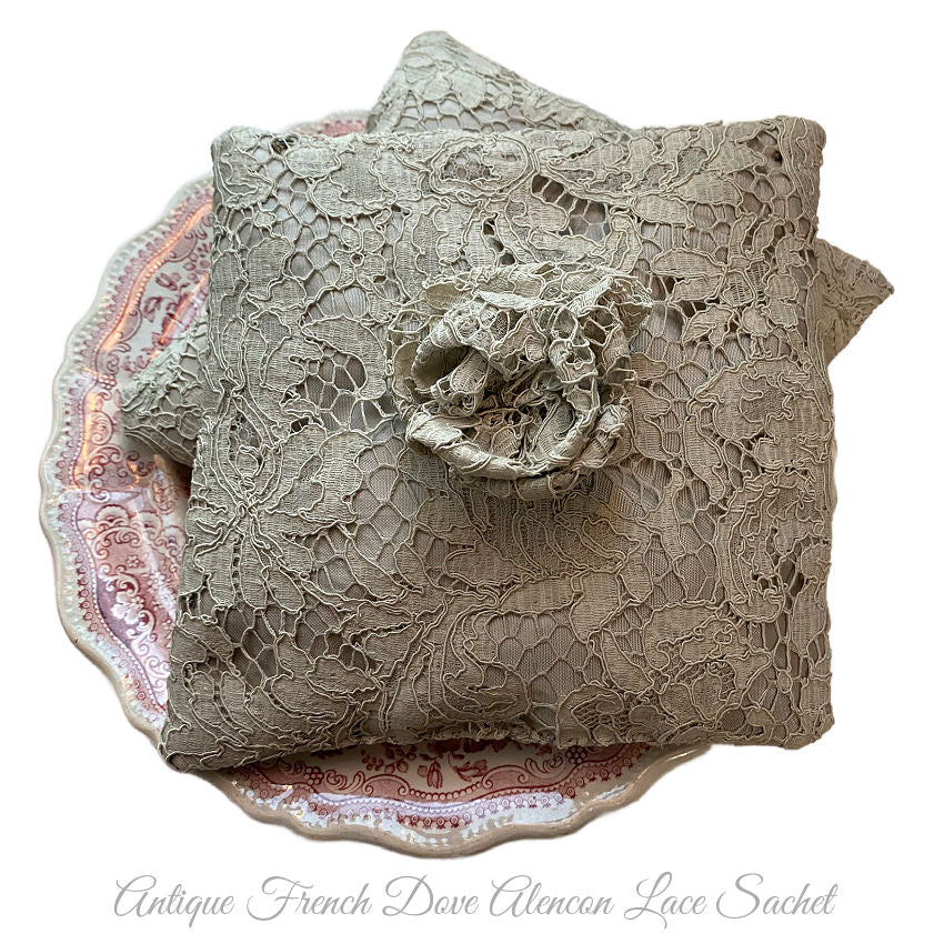 Antique French Alençon lace lavender sachet pillow in dove grey, handmade by Parisian atelier and filled with fragrant French lavender. Elegant luxury for linens and drawers.