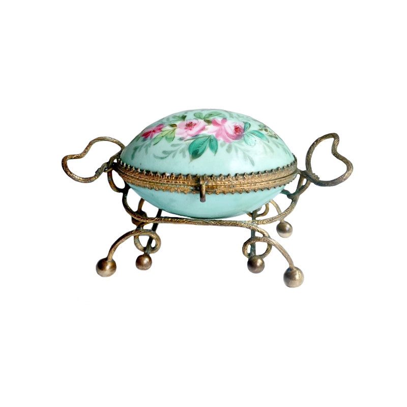 Antique French Palais Royal porcelain egg-shaped casket with gilt ormolu mounts. A rare 19th century objet de vertu of refined Parisian luxury.