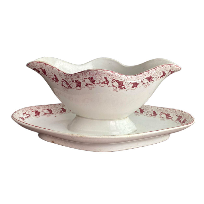 Antique French St. Amand porcelain sauce boat with red leaf design. Elegant Belle Époque tableware with timeless French charm.