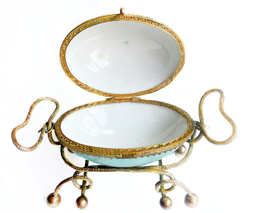 Antique French Palais Royal porcelain egg-shaped casket with gilt ormolu mounts. A rare 19th century objet de vertu of refined Parisian luxury.