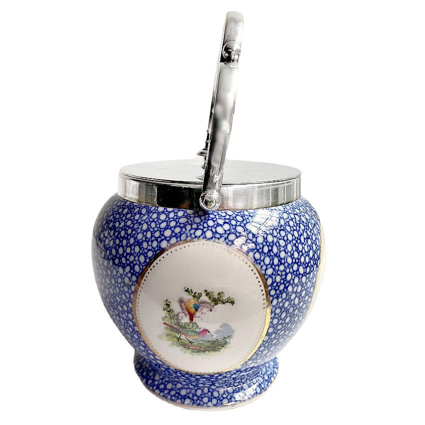 close detail of silver plated lid and handle on antique biscuit barrel