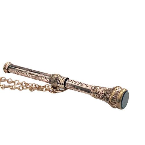 Antique gold-filled chatelaine pencil necklace with bloodstone end showing details.