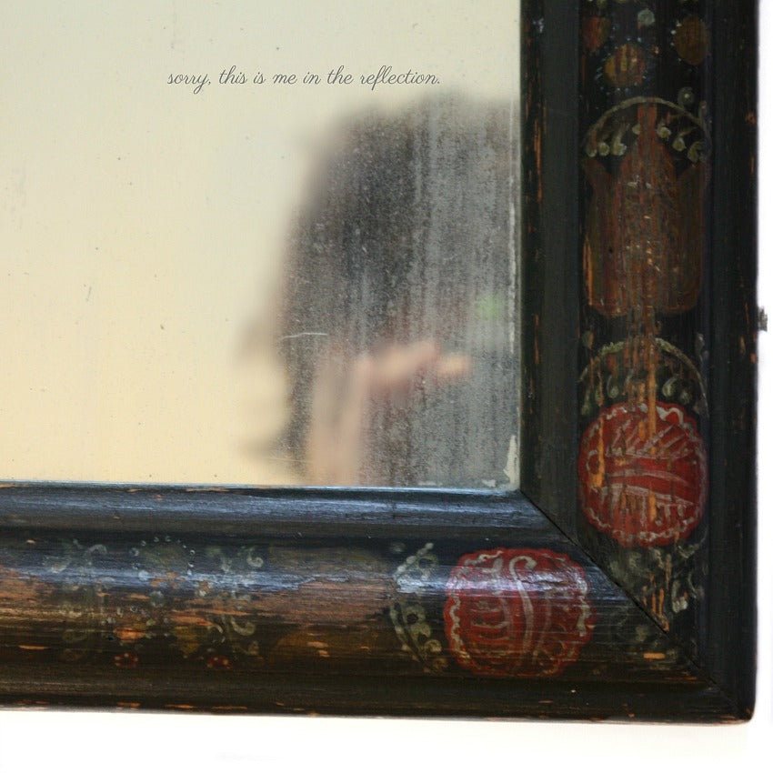 Antique hand painted French courting mirror with red flowers and softly aged glass with subtle ghosting and patina