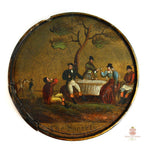 Antique circular French Vernis Martin lacquer snuff box depicting a hand-painted outdoor social gathering scene.