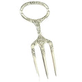Antique Sheffield Silver Plate Meat or Game Carving Fork with a traditional trident three tine prong end and a circular handle decorated with intricate art nouveau design.