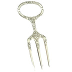 Antique Sheffield Silver Plate Meat or Game Carving Fork with a traditional trident three tine prong end and a circular handle decorated with intricate art nouveau design.