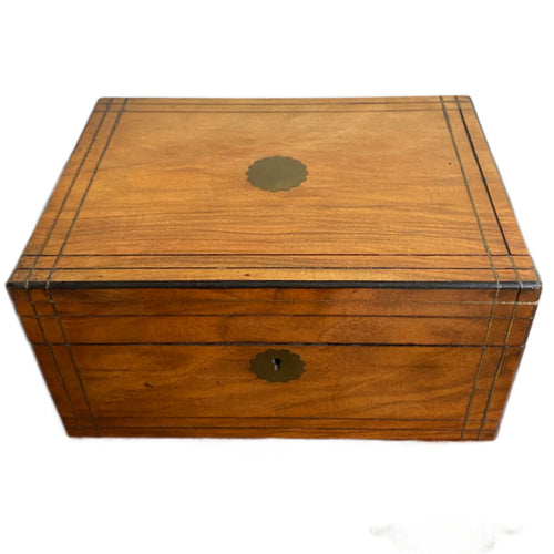 Exterior view of walnut-hued Victorian inlaid sewing box with brass detailing