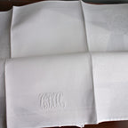 antique white linen napkins styled on elegant table setting