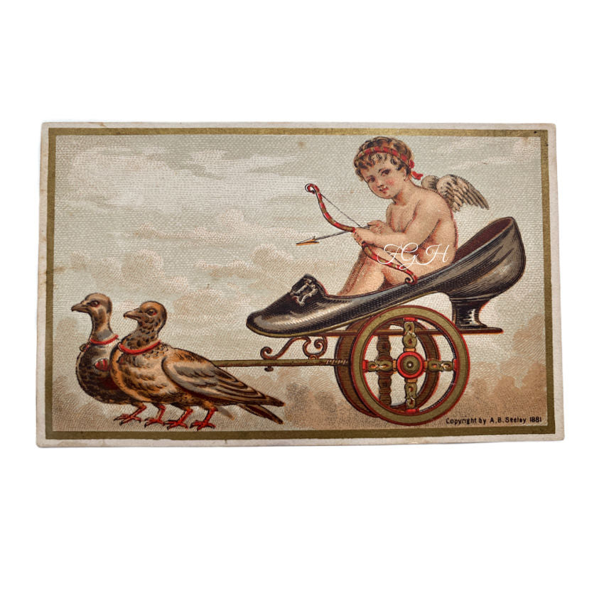 Advertising Trade  cardVintage-style illustration of a cherub in a shoe with wings, pulling a cart with birds, on a textured background.