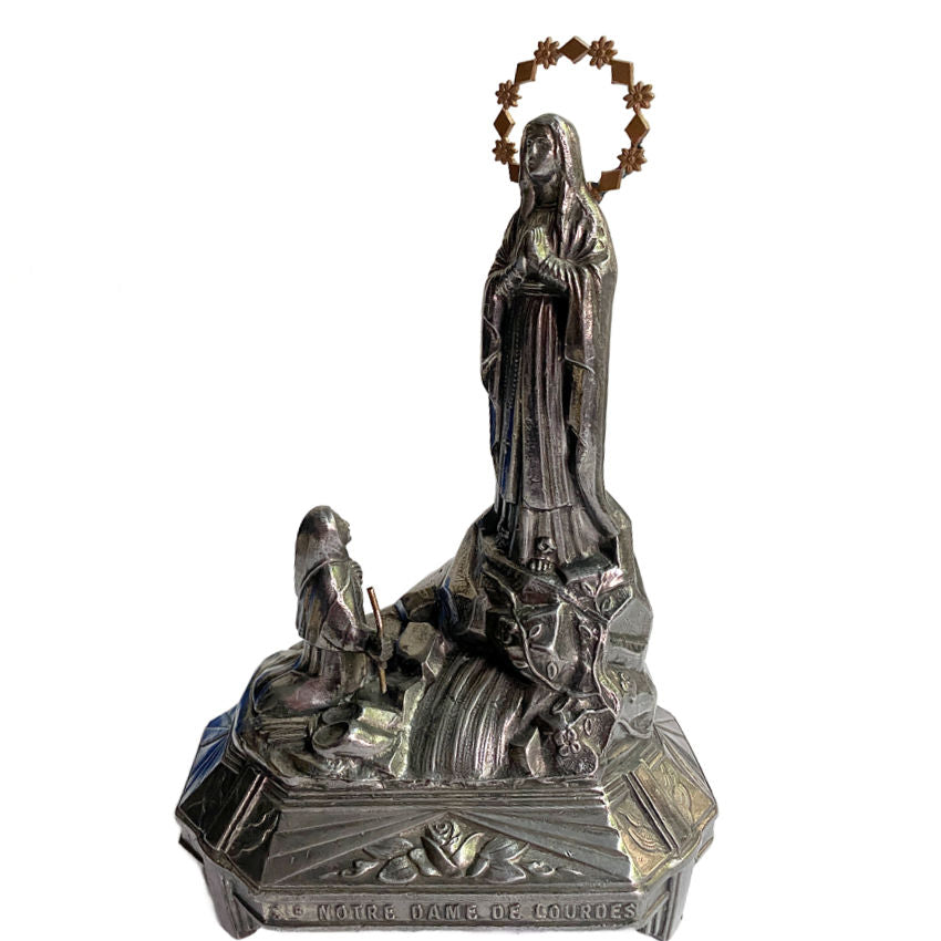Antique Art Deco French Notre Dame de Lourdes Virgin Mary figure in dark metal with gilded halo and rose-adorned base.