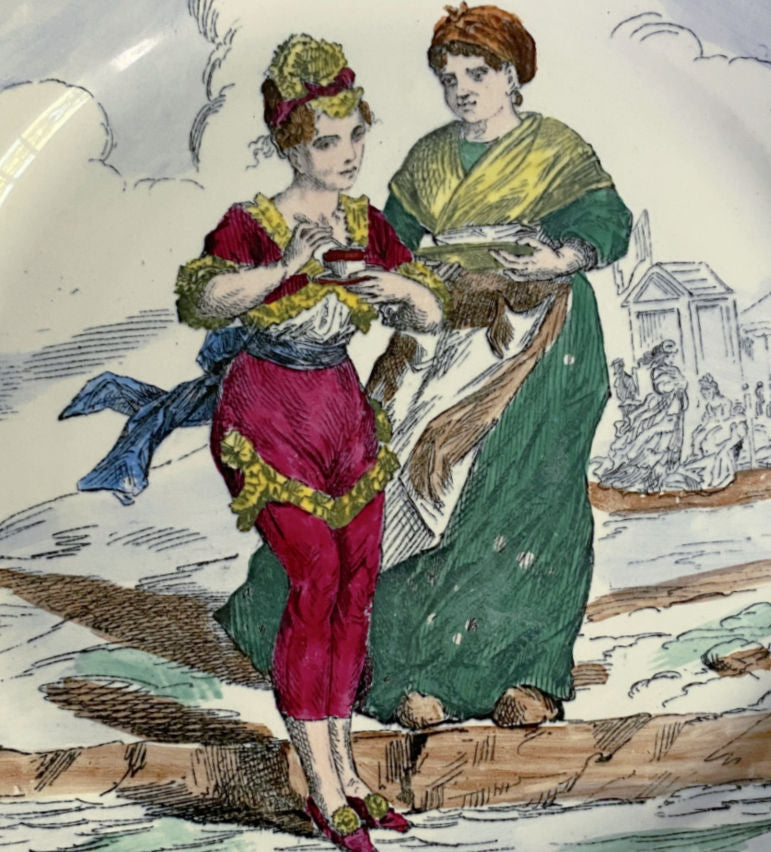 Detail of hand painted figures on antique French faience plate showing romantic classical scene