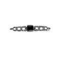 A sterling silver bar pin with a central black onyx stone and small marcasite decorations.