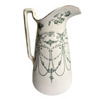 A rare color Empire pattern Royal Ironstone pitcher in teal green, showcasing elegant 19th-century English tableware, perfect for collectors and decorative display.