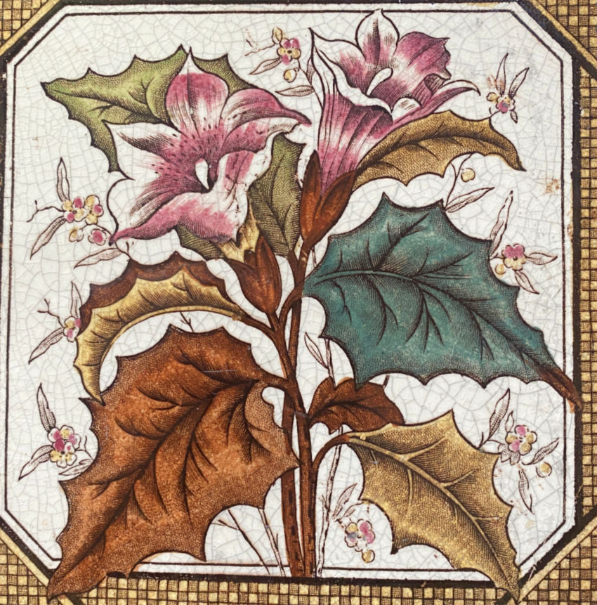 Antique aesthetic hand-painted ceramic tile with a floral design, featuring pink lilies, green and brown leaves, and brown basket weave border.