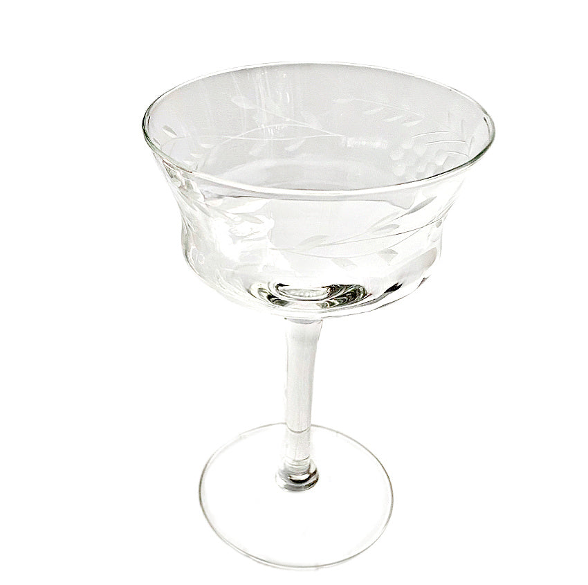 Elegant set of six vintage etched floral cocktail coupes with flared bowls. Delicate, heirloom-style glassware perfect for refined entertaining and celebrations.