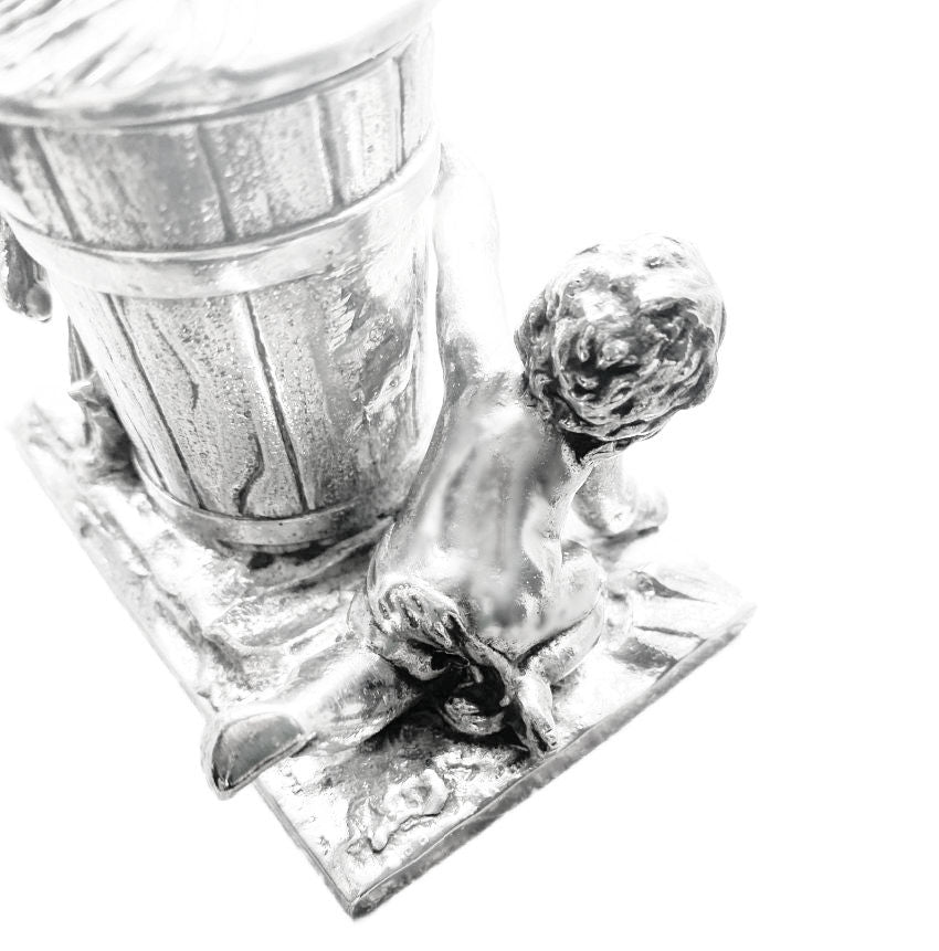 Detail of expressive figural casting and soft silver patina