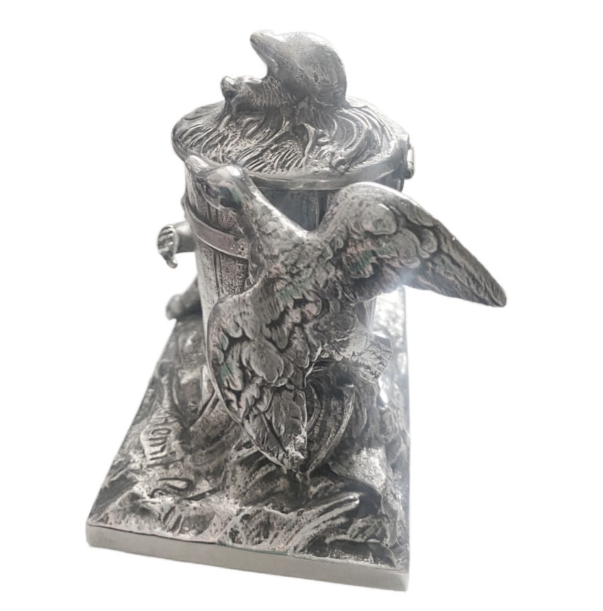 Antique French Art Nouveau silver-plated figural ink well featuring a child, goose, and snail with a barrel-shaped inkwell.