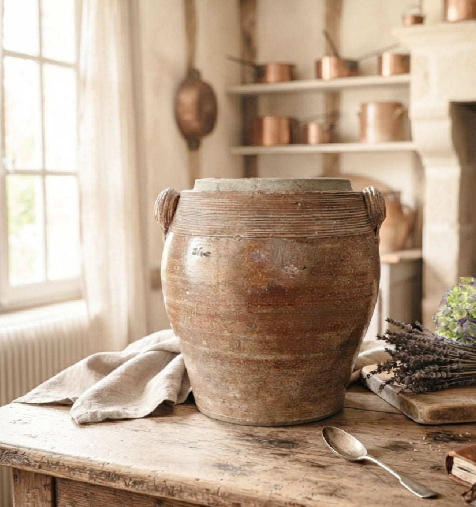antique French confit pot, brown glazed French pottery, antique French country kitchen decor styled on a table with copper pots, lavender and hydrangeas