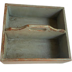 Interior view of antique wooden work box with softened green finish and natural wood grain