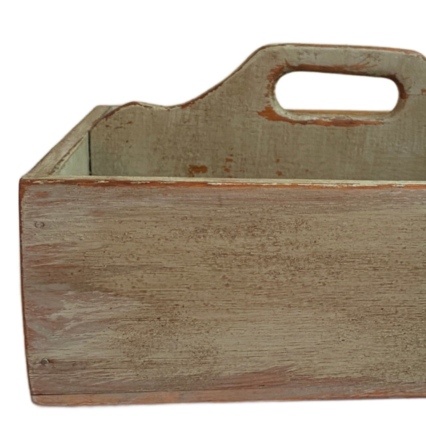 Close-up of antique French Country wooden work box with mellow green painted surface and aged patina