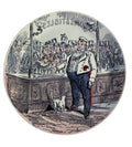 Front view of 19th-century Creil-Montereau faience plate showing interior shop scene with a cat and crowds peering at the window display from outside.