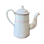 Antique French enamelware cafetière in white and pink with classic form, soft patina, and charming hand-painted details.