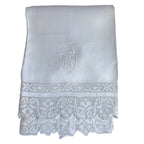 Antique French hand-embroidered towel with crowned lion monogram and lace trim—noble 19th-century linen with exquisite detail and timeless elegance.