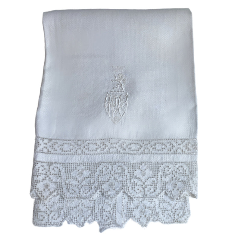 Antique French hand-embroidered towel with crowned lion monogram and lace trim—noble 19th-century linen with exquisite detail and timeless elegance.