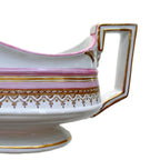 French porcelain sauce boat with pink painted accents and gold border decoration handle view
