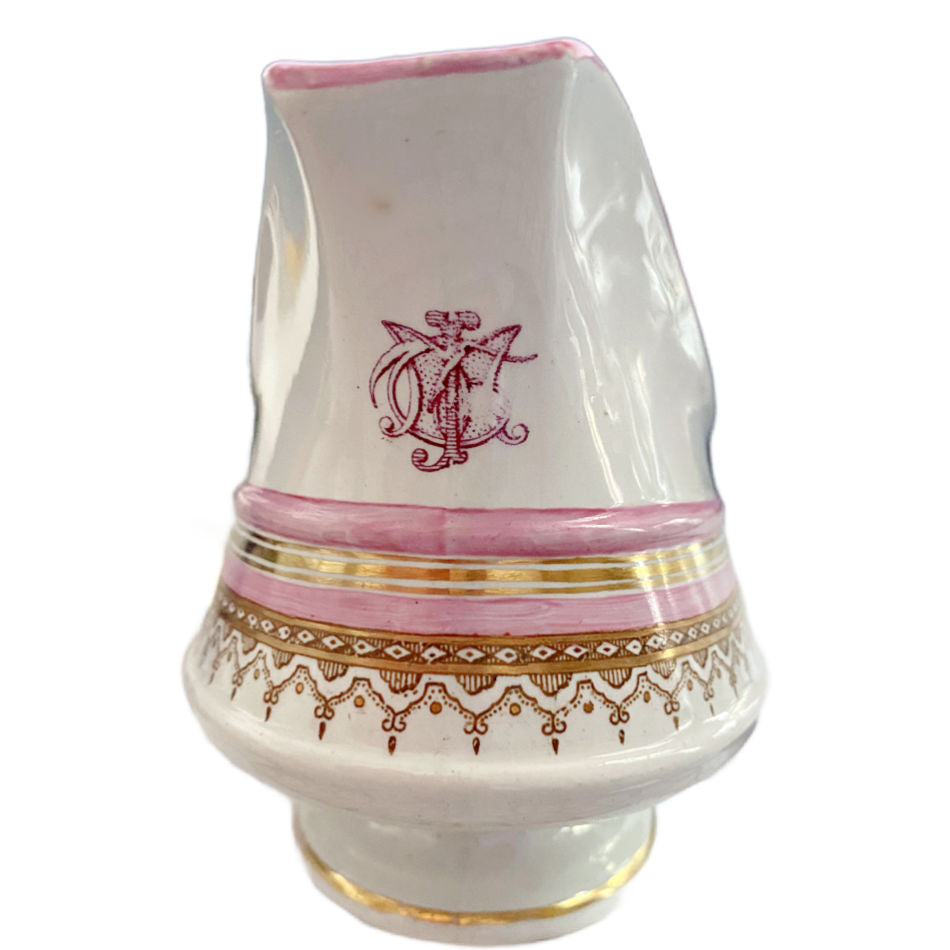 19th century French porcelain sauce boat with monogram detail near spout