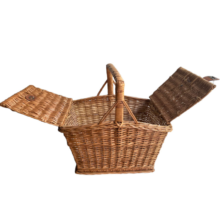 Antique French willow picnic basket double opening, leather closure strap for display in French Country interior