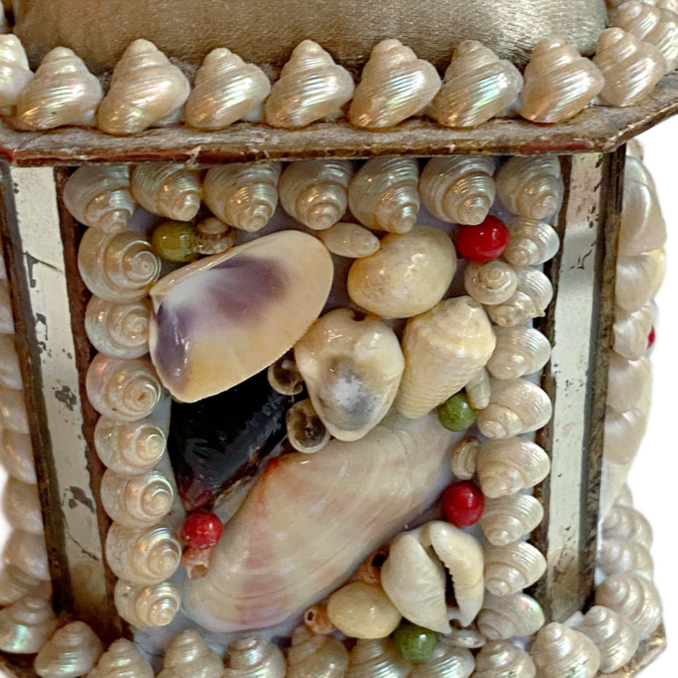Antique French souvenir box with shellwork, mirrors, and green silk close up