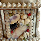 Antique French souvenir box with shellwork, mirrors, and green silk close up