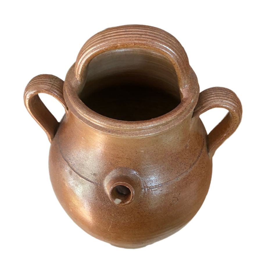 Close-up of warm honey-brown glaze on antique French gargoulette top