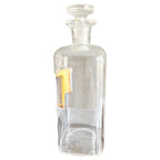 Antique glass medicine bottle decorative object for a collected home side view