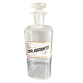 Antique glass apothecary bottle with Syrup Aurantii label under glass