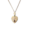 Antique gold-filled heart locket with forget-me-not flowers