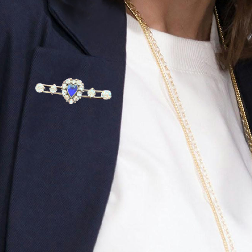 Antique Victorian bar pin in gold  set with sparkling paste stones and a vivid blue heart. Timeless romantic jewelry.