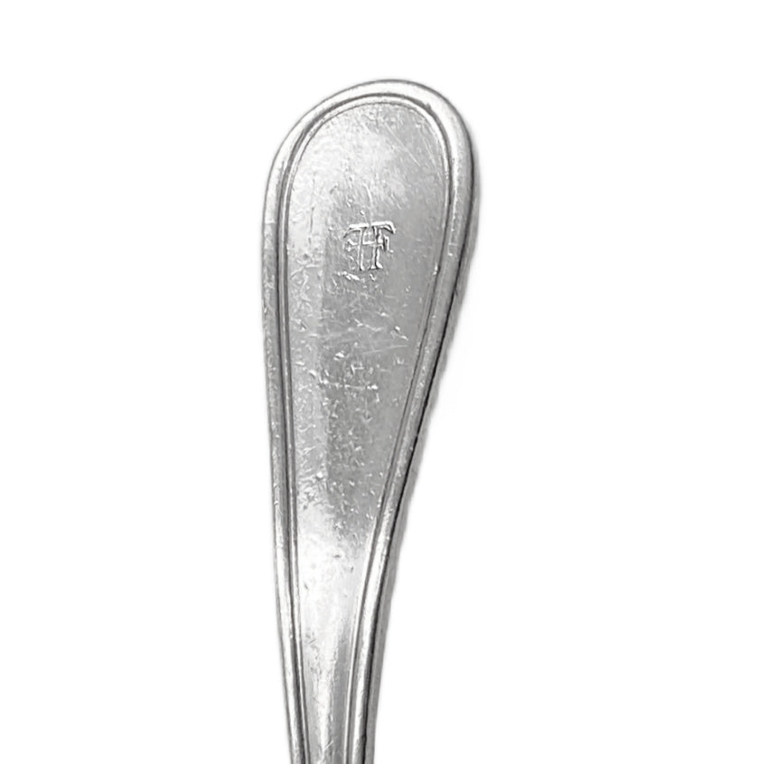 Antique Hotel Fontenelle silver gravy ladle with rich patina and classic hotel weight—an elegant, collectible piece of historic American hotel silver.