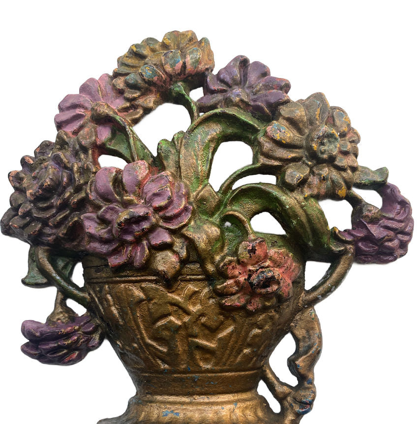 Antique American floral urn doorstop with aged painted finish detail