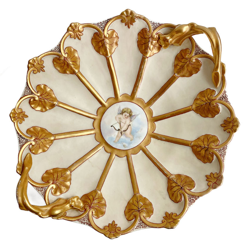 Antique JPL Jean Pouyat Limoges porcelain bowl with hand-painted cherub and lavish gilt lily pad handles. A rare signed French Art Nouveau serving piece, circa 1894.