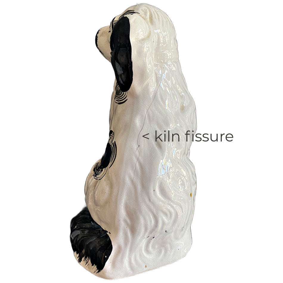 Antique English Staffordshire style spaniel figure showing original firing fissure